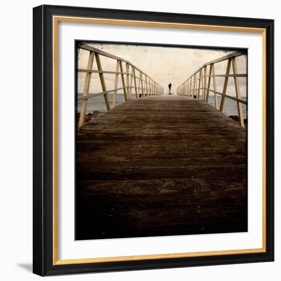 A Long Wooden Walkway at the Sea with a Figure Standing in the Distance-Luis Beltran-Framed Photographic Print
