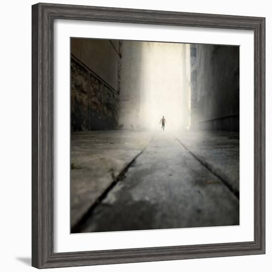 A Low Level View of a Boy Running Along the Street-Luis Beltran-Framed Photographic Print