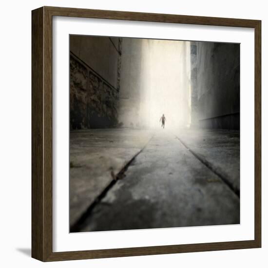 A Low Level View of a Boy Running Along the Street-Luis Beltran-Framed Photographic Print