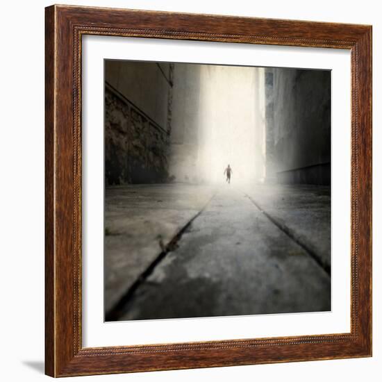 A Low Level View of a Boy Running Along the Street-Luis Beltran-Framed Photographic Print