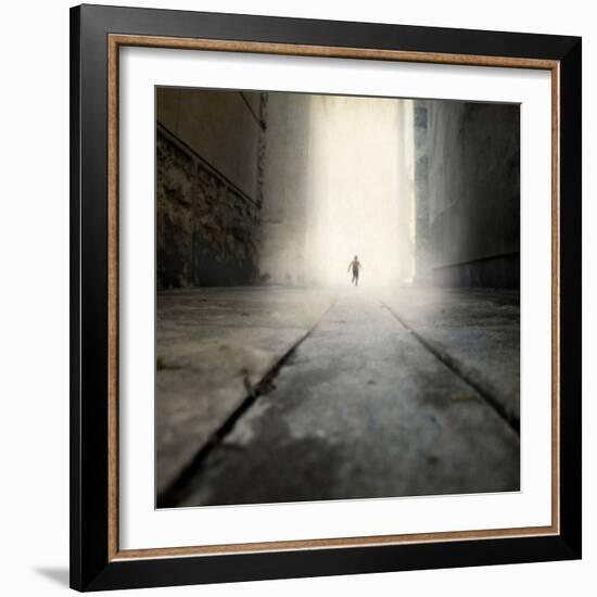 A Low Level View of a Boy Running Along the Street-Luis Beltran-Framed Photographic Print