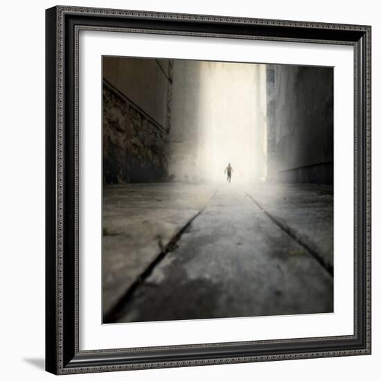 A Low Level View of a Boy Running Along the Street-Luis Beltran-Framed Photographic Print