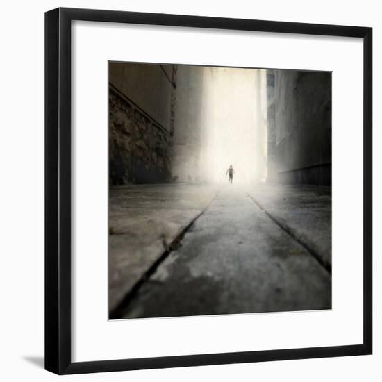 A Low Level View of a Boy Running Along the Street-Luis Beltran-Framed Photographic Print