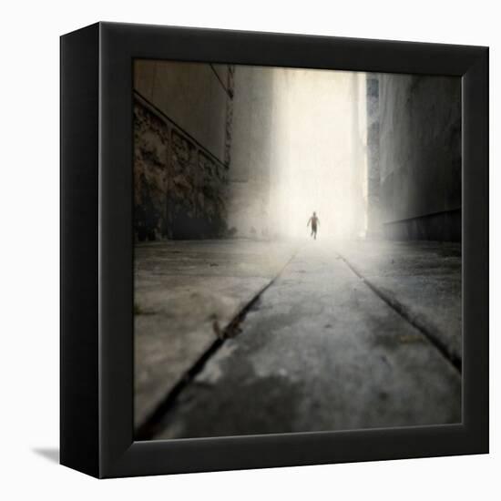 A Low Level View of a Boy Running Along the Street-Luis Beltran-Framed Premier Image Canvas