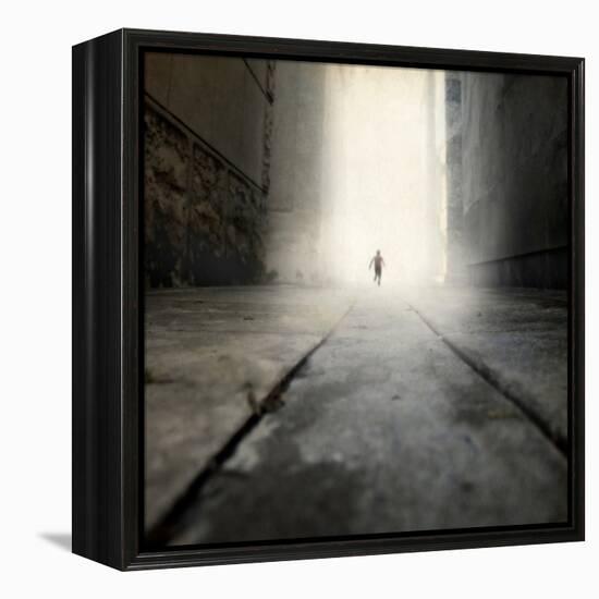 A Low Level View of a Boy Running Along the Street-Luis Beltran-Framed Premier Image Canvas