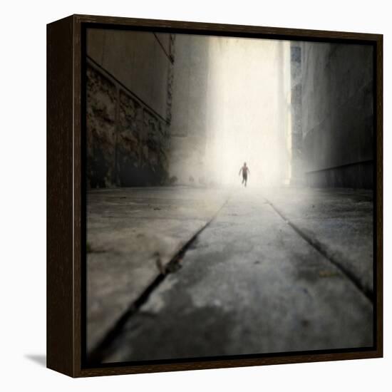 A Low Level View of a Boy Running Along the Street-Luis Beltran-Framed Premier Image Canvas