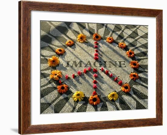 A Makeshift Peace Sign of Flowers Lies on Top John Lennon's Strawberry Fields Memorial-null-Framed Premium Photographic Print