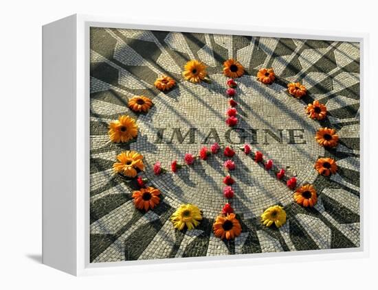 A Makeshift Peace Sign of Flowers Lies on Top John Lennon's Strawberry Fields Memorial-null-Framed Premier Image Canvas