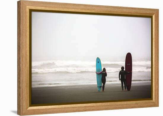 A Male And Female Surfer Hold Their Surfboards In The Olympic National Park In Washington State-Ben Herndon-Framed Premier Image Canvas