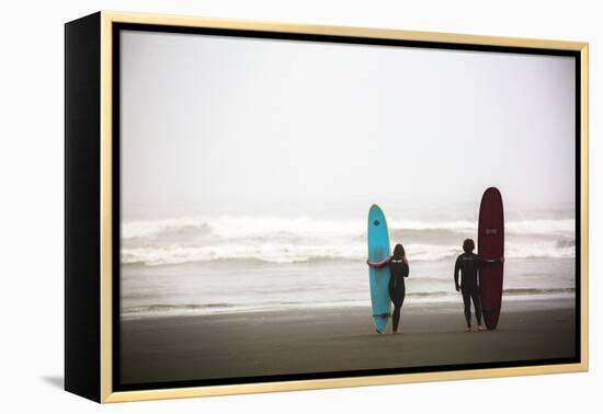 A Male And Female Surfer Hold Their Surfboards In The Olympic National Park In Washington State-Ben Herndon-Framed Premier Image Canvas