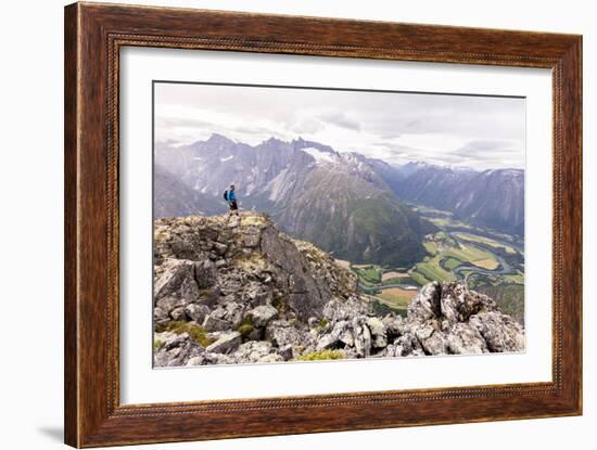 A Male Hiker On A Cliff Enjoying The View Over The Rauma (River) Valley In Norway-Axel Brunst-Framed Photographic Print