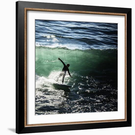 A Male Surfer Rides An Emerald Colored Wave In The Pacific Ocean Off The Coast Of Santa Cruz-Ron Koeberer-Framed Photographic Print