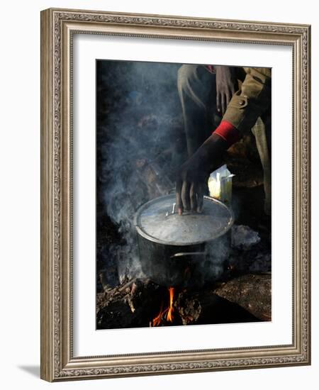 A Man, 24, from Ghana, Prepares His Meal-null-Framed Photographic Print