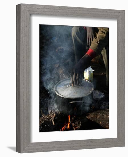 A Man, 24, from Ghana, Prepares His Meal-null-Framed Photographic Print