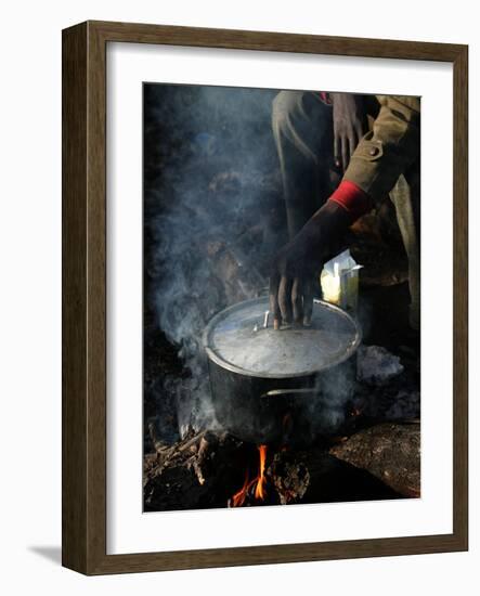 A Man, 24, from Ghana, Prepares His Meal-null-Framed Photographic Print