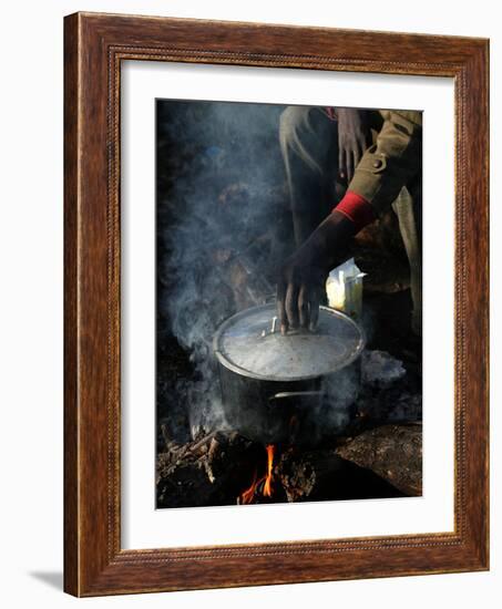 A Man, 24, from Ghana, Prepares His Meal-null-Framed Photographic Print