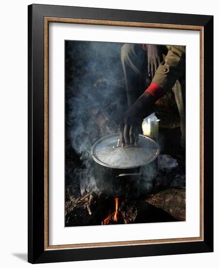 A Man, 24, from Ghana, Prepares His Meal-null-Framed Photographic Print