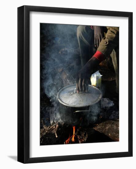 A Man, 24, from Ghana, Prepares His Meal-null-Framed Photographic Print