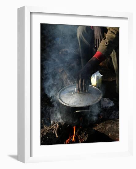 A Man, 24, from Ghana, Prepares His Meal-null-Framed Photographic Print