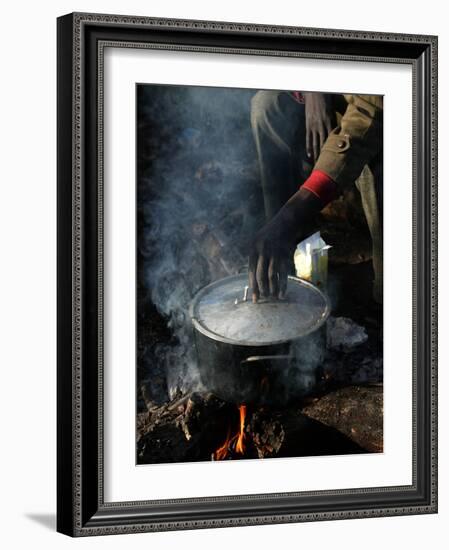 A Man, 24, from Ghana, Prepares His Meal-null-Framed Photographic Print