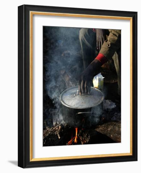 A Man, 24, from Ghana, Prepares His Meal-null-Framed Photographic Print