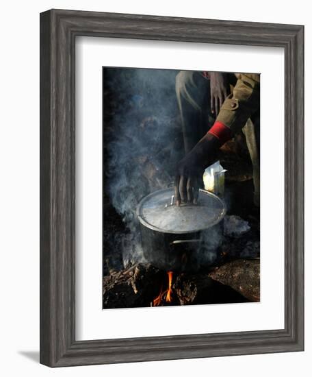 A Man, 24, from Ghana, Prepares His Meal-null-Framed Photographic Print