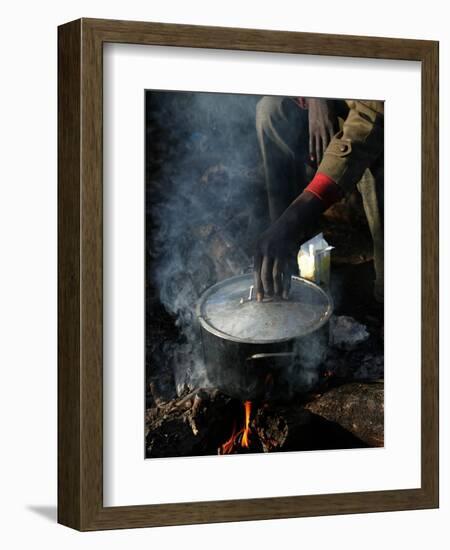 A Man, 24, from Ghana, Prepares His Meal-null-Framed Photographic Print