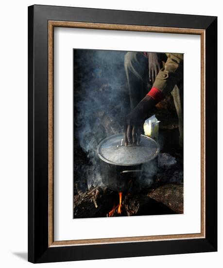 A Man, 24, from Ghana, Prepares His Meal-null-Framed Photographic Print