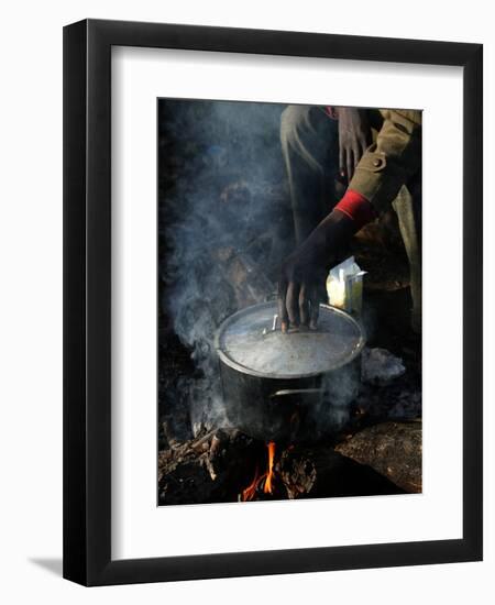 A Man, 24, from Ghana, Prepares His Meal-null-Framed Photographic Print