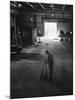 A Man Cleaning Up the Empty Sound Stage-null-Mounted Photographic Print