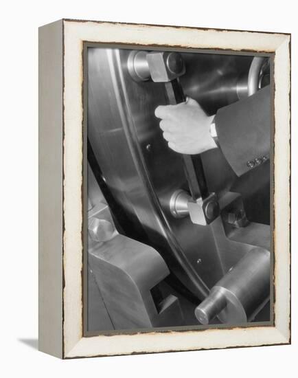 A Man Closes a Large Bank Vault-Philip Gendreau-Framed Premier Image Canvas