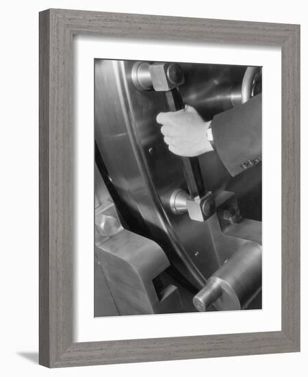 A Man Closes a Large Bank Vault-Philip Gendreau-Framed Photographic Print