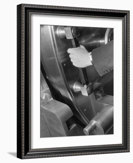 A Man Closes a Large Bank Vault-Philip Gendreau-Framed Photographic Print