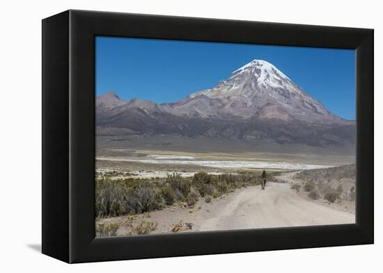 A Man Cycles in the Shadow of Sajama Volcano in Sajama National Park-Alex Saberi-Framed Premier Image Canvas