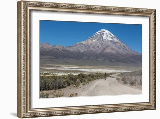 A Man Cycles in the Shadow of Sajama Volcano in Sajama National Park-Alex Saberi-Framed Photographic Print