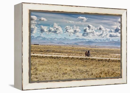 A Man Cycles with a Family Member on the Back of His Bicycle Between La Paz and Tiwanaku-Alex Saberi-Framed Premier Image Canvas