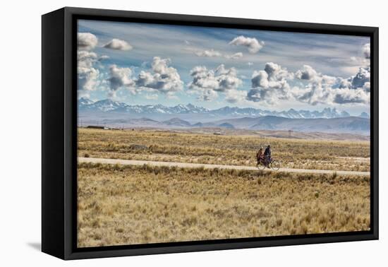 A Man Cycles with a Family Member on the Back of His Bicycle Between La Paz and Tiwanaku-Alex Saberi-Framed Premier Image Canvas