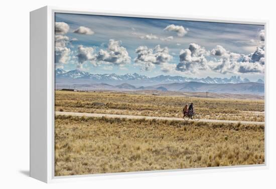 A Man Cycles with a Family Member on the Back of His Bicycle Between La Paz and Tiwanaku-Alex Saberi-Framed Premier Image Canvas