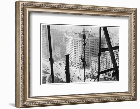 A Man Hangs Precariously from a Line During the Construction of a Skyscraper in New York-null-Framed Photographic Print