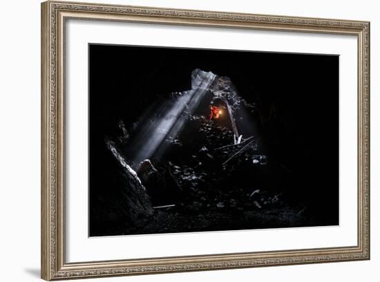 A Man Holding A Propane Lantern Exits The Cheese Cave, A 2,000 Foot Lava Tube-Ben Herndon-Framed Photographic Print