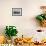 A man paddles his canoe past one of the floating villages on Inle Lake, Myanmar (Burma), Asia-Alex Treadway-Framed Photographic Print displayed on a wall