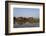 A man paddles his canoe past one of the floating villages on Inle Lake, Myanmar (Burma), Asia-Alex Treadway-Framed Photographic Print