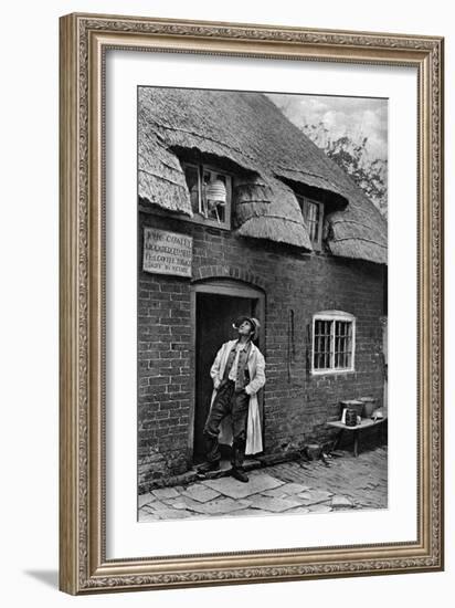 A Man Smoking a Pipe Outside a Shop, Worcestershire, C1922-AW Cutler-Framed Giclee Print