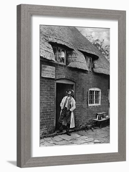 A Man Smoking a Pipe Outside a Shop, Worcestershire, C1922-AW Cutler-Framed Giclee Print