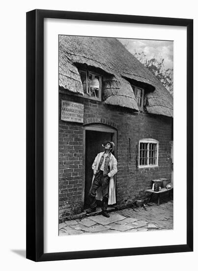 A Man Smoking a Pipe Outside a Shop, Worcestershire, C1922-AW Cutler-Framed Giclee Print