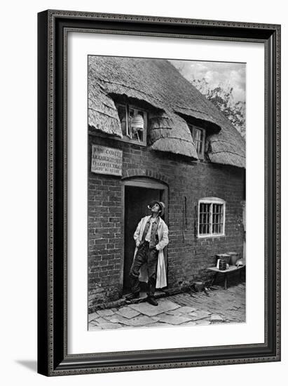 A Man Smoking a Pipe Outside a Shop, Worcestershire, C1922-AW Cutler-Framed Giclee Print