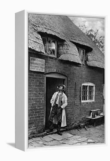 A Man Smoking a Pipe Outside a Shop, Worcestershire, C1922-AW Cutler-Framed Premier Image Canvas