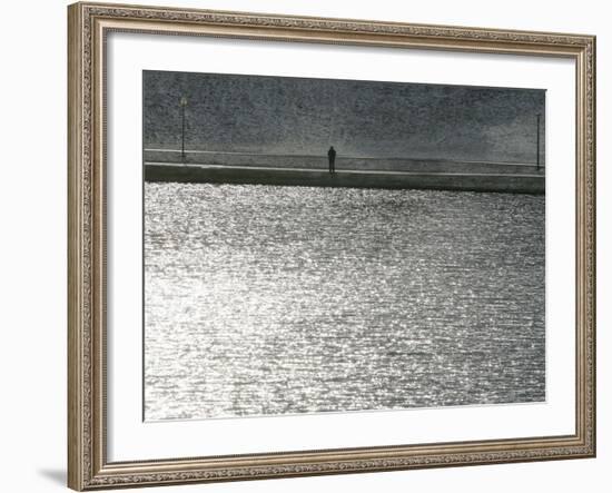 A Man Stands on the Banks of a Small Lake, Munich, on Friday, November 3, 2006.-Christof Stache-Framed Photographic Print