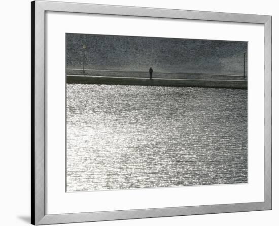 A Man Stands on the Banks of a Small Lake, Munich, on Friday, November 3, 2006.-Christof Stache-Framed Photographic Print