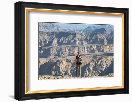 A Man Stands on the Edge of the Fish River Canyon, Namibia, Africa-Alex Treadway-Framed Photographic Print